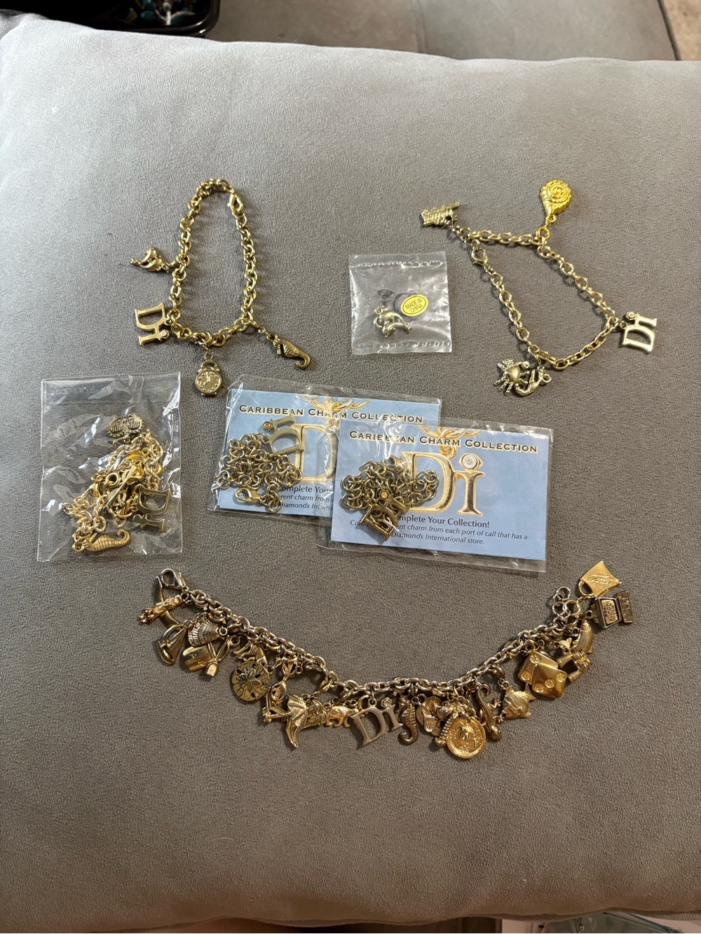 DI Diamond International Goldtone Charm Bracelet 23 Charms Plus 5 Bracelets LOT